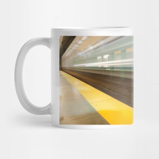 Platform with yellow line railway tracks blurred in motion blur aws train passes. Mug